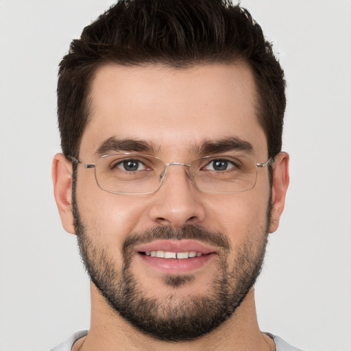 Joyful white young-adult male with short  brown hair and brown eyes