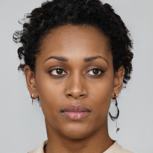 Neutral black young-adult female with short  black hair and brown eyes