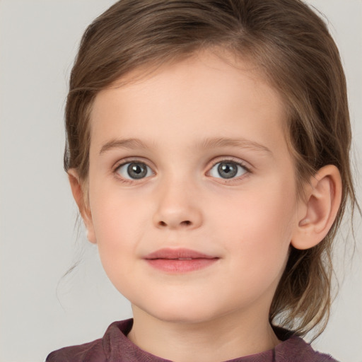 Joyful white child female with medium  brown hair and grey eyes