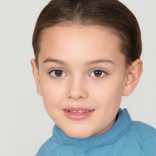 Joyful white child female with short  brown hair and brown eyes