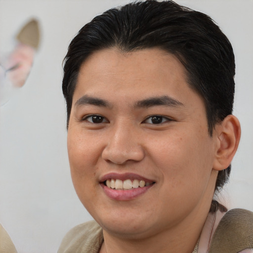 Joyful asian young-adult female with short  brown hair and brown eyes