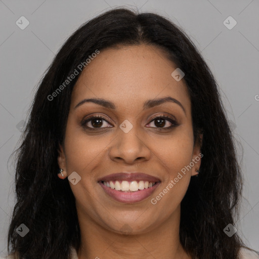 Joyful black young-adult female with long  brown hair and brown eyes