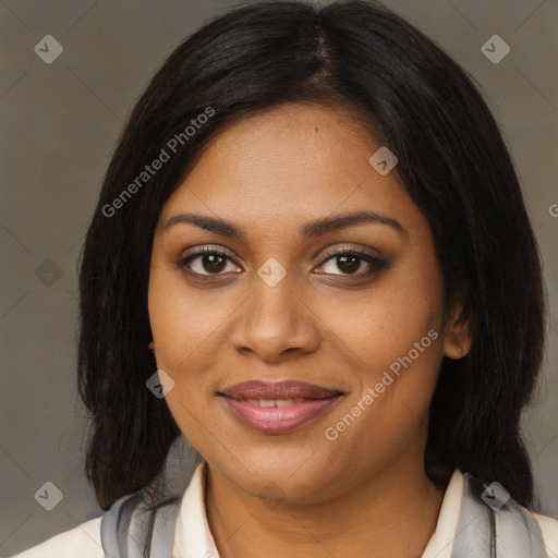 Joyful black young-adult female with medium  brown hair and brown eyes