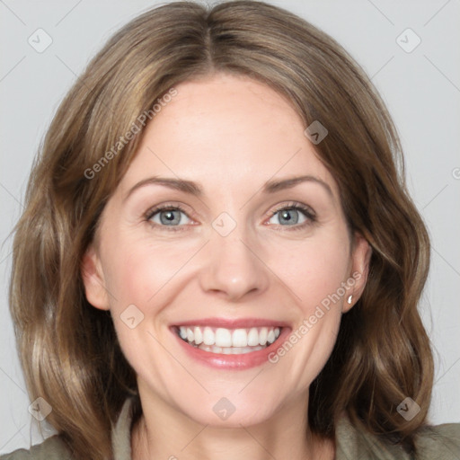 Joyful white adult female with medium  brown hair and grey eyes