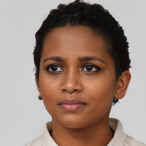 Neutral black young-adult female with short  black hair and brown eyes