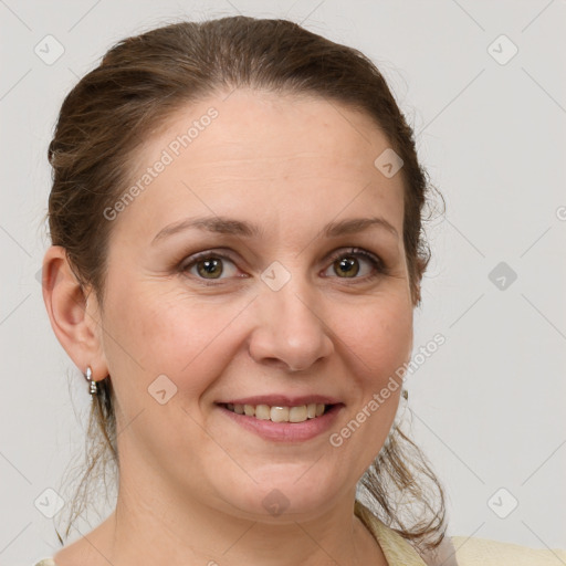 Joyful white adult female with medium  brown hair and grey eyes