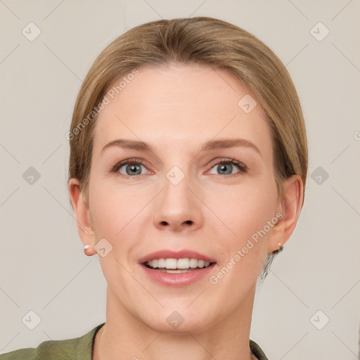 Joyful white young-adult female with short  brown hair and grey eyes