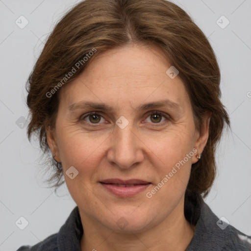 Joyful white adult female with medium  brown hair and grey eyes