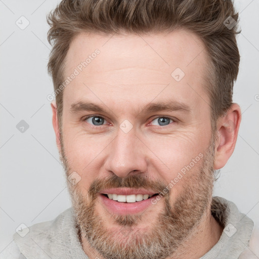 Joyful white adult male with short  brown hair and grey eyes