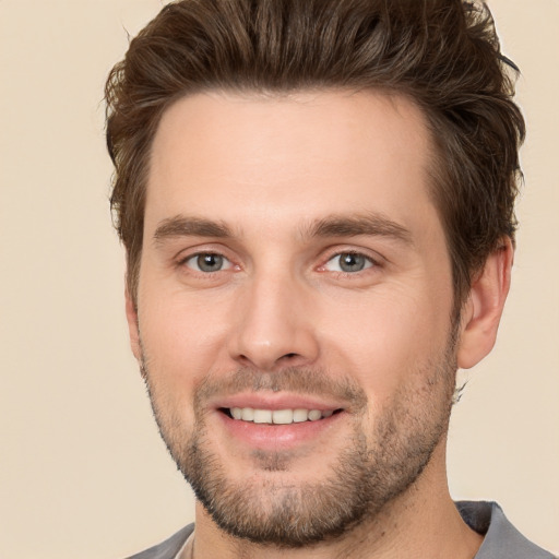 Joyful white young-adult male with short  brown hair and brown eyes