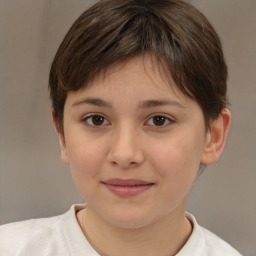 Joyful white child female with short  brown hair and brown eyes