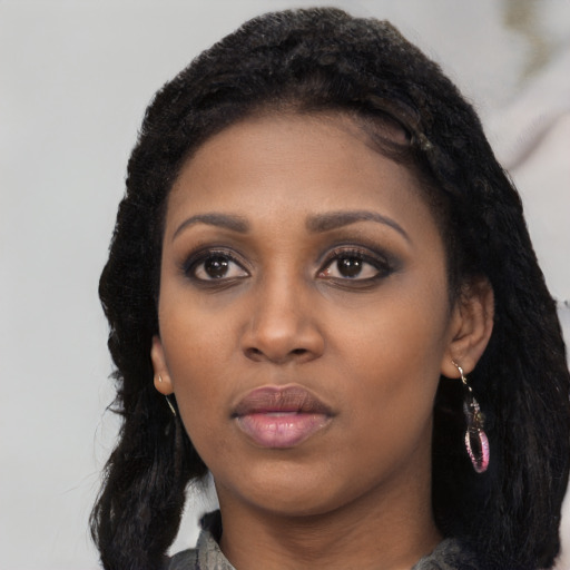 Neutral black young-adult female with long  black hair and brown eyes