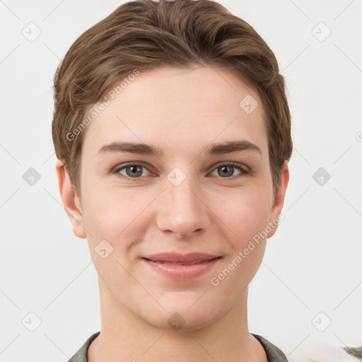 Joyful white young-adult female with short  brown hair and grey eyes