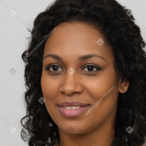 Joyful black young-adult female with long  brown hair and brown eyes