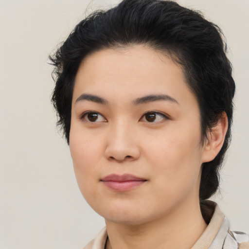 Joyful asian young-adult female with medium  black hair and brown eyes