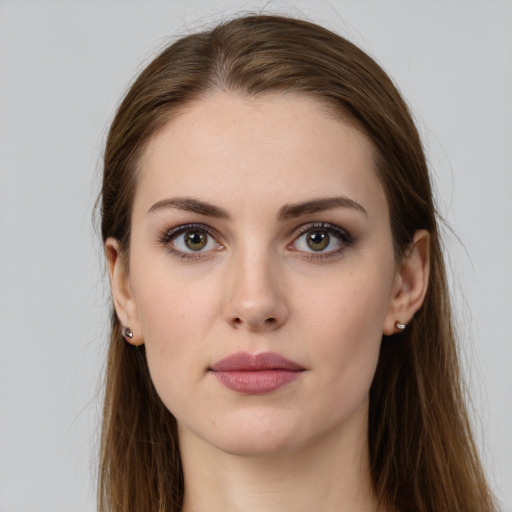 Neutral white young-adult female with long  brown hair and green eyes