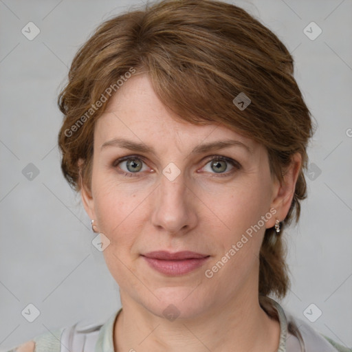 Joyful white adult female with medium  brown hair and grey eyes