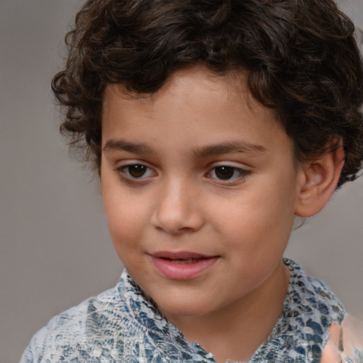 Joyful white child male with short  brown hair and brown eyes