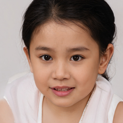 Joyful white child female with medium  brown hair and brown eyes