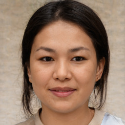 Joyful asian young-adult female with medium  brown hair and brown eyes