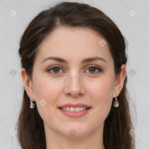 Joyful white young-adult female with long  brown hair and green eyes