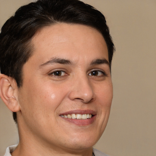 Joyful white young-adult male with short  brown hair and brown eyes