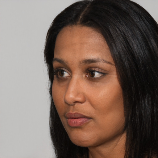 Neutral black adult female with long  black hair and brown eyes