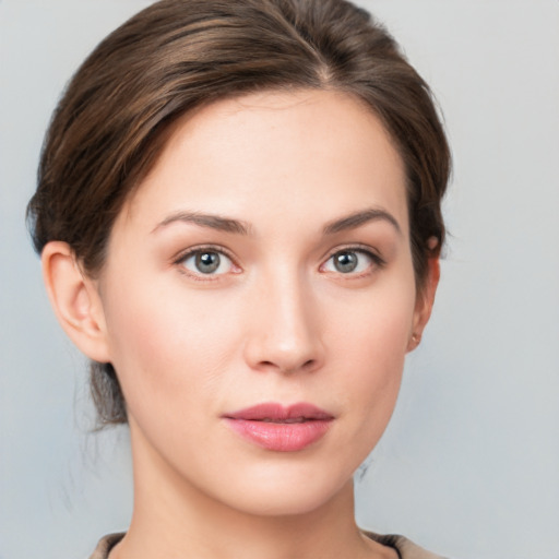 Neutral white young-adult female with medium  brown hair and grey eyes