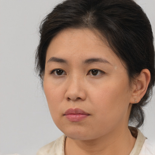Neutral asian young-adult female with medium  brown hair and brown eyes