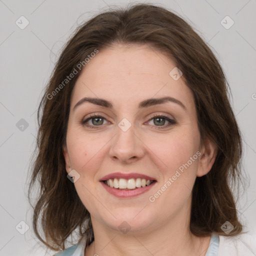 Joyful white young-adult female with medium  brown hair and green eyes