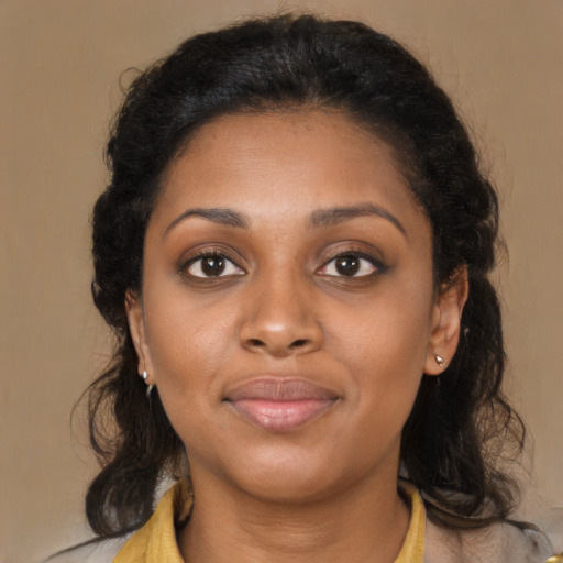 Joyful black young-adult female with medium  brown hair and brown eyes