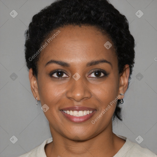 Joyful black young-adult female with short  black hair and brown eyes