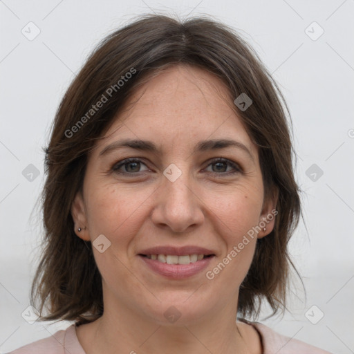 Joyful white adult female with medium  brown hair and grey eyes