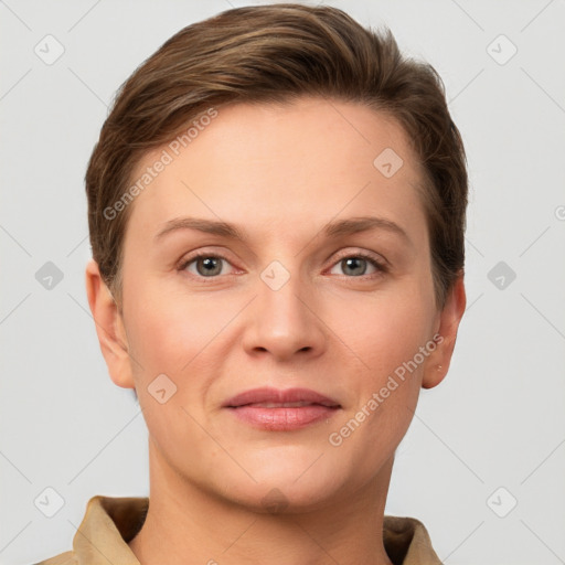 Joyful white young-adult female with short  brown hair and grey eyes