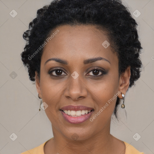 Joyful black young-adult female with short  black hair and brown eyes