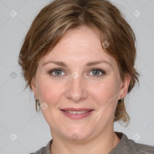 Joyful white adult female with medium  brown hair and grey eyes