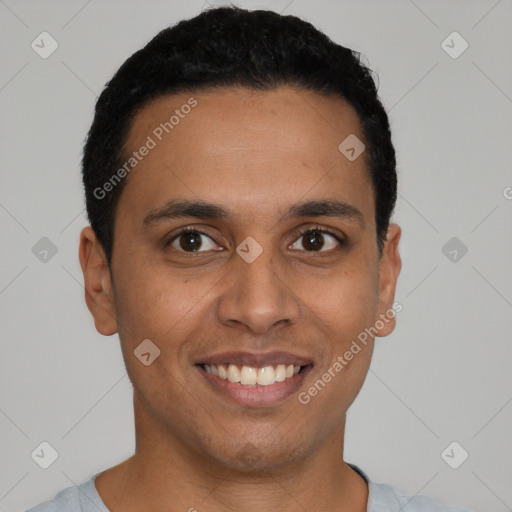 Joyful latino young-adult male with short  black hair and brown eyes