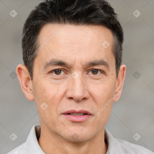 Joyful white adult male with short  brown hair and brown eyes