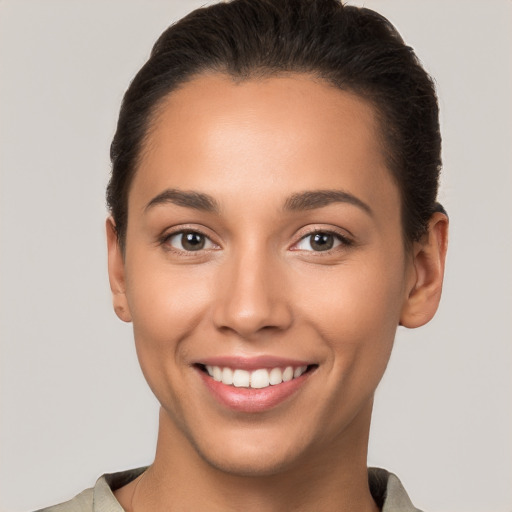 Joyful white young-adult female with short  brown hair and brown eyes