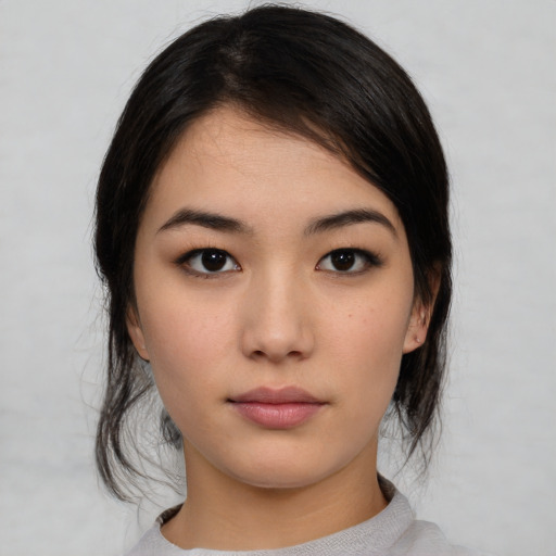 Neutral asian young-adult female with medium  black hair and brown eyes
