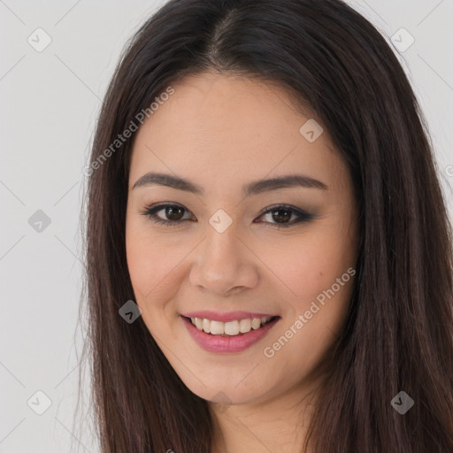 Joyful asian young-adult female with long  brown hair and brown eyes