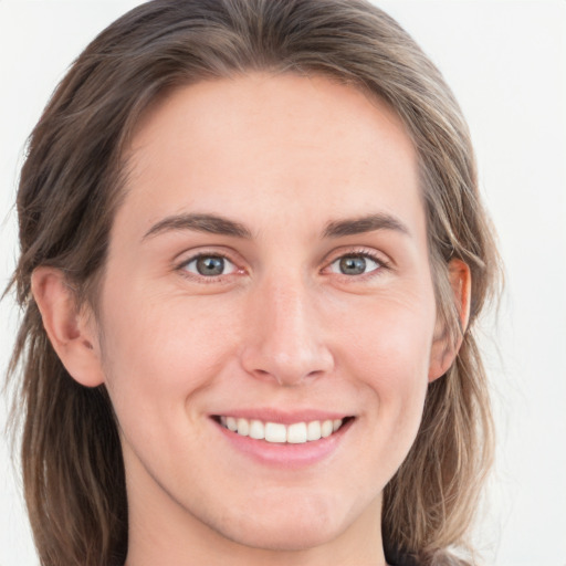 Joyful white young-adult female with long  brown hair and blue eyes