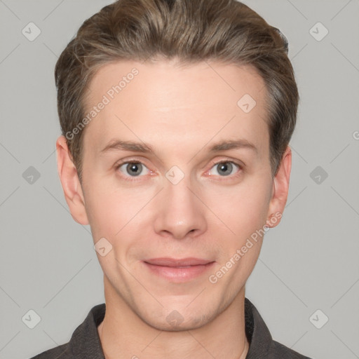 Joyful white adult male with short  brown hair and grey eyes