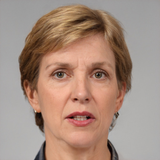 Joyful white adult female with medium  brown hair and grey eyes