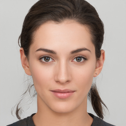 Neutral white young-adult female with medium  brown hair and brown eyes