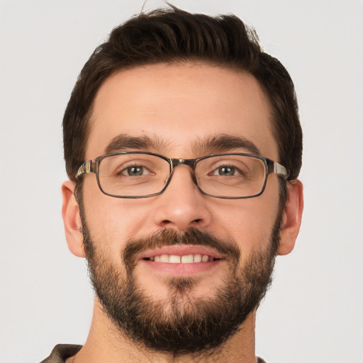 Joyful white young-adult male with short  brown hair and brown eyes