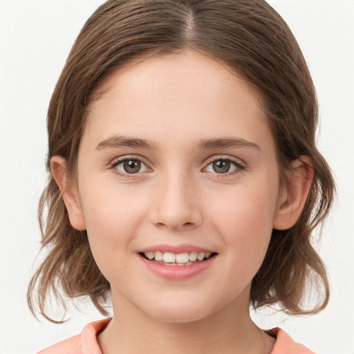 Joyful white child female with medium  brown hair and grey eyes