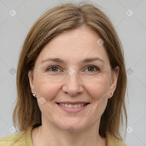 Joyful white adult female with medium  brown hair and grey eyes