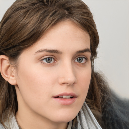 Neutral white young-adult female with medium  brown hair and brown eyes