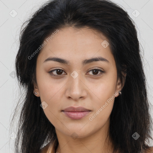 Joyful latino young-adult female with long  brown hair and brown eyes